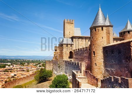 Old Carcassonne City With Its Towers Over Blue Sky