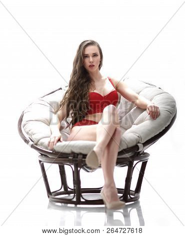 Sexy Young Woman In Red Underwear Sitting In Papasan Chair