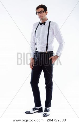 Full Body Shot Of Young Handsome Man Standing While Wearing Susp