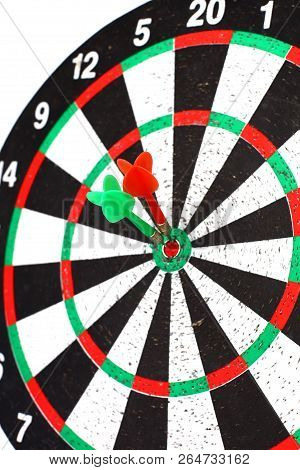 Closeup. Several Arrows Dart Hitting The Center Of The Target D