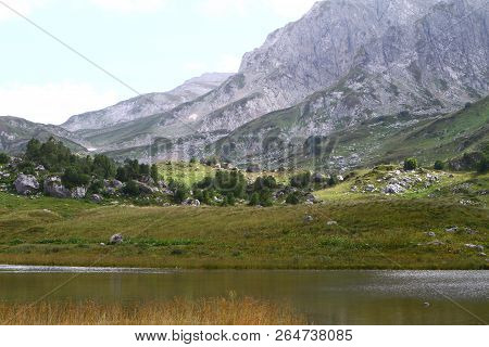 Natural Landscape Photo Of Small Mountain Lake Psenodah In North Caucasus Near Fisht And Oshten Moun