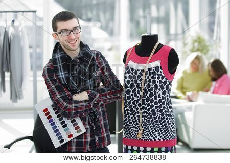 Creative Fashion Designer Standing In His Studio