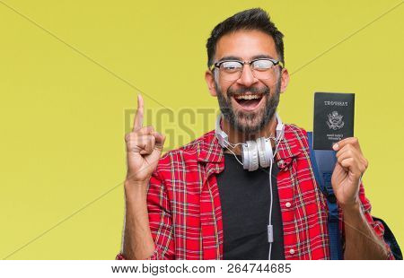 Adult hispanic student man holding passport of america over isolated background surprised with an idea or question pointing finger with happy face, number one