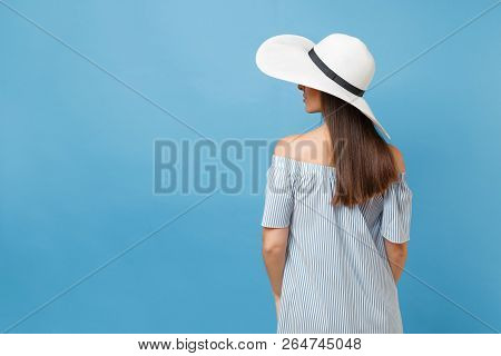 Back View Portrait Of Elegant Fashion Young Woman In White Summer Large Wide Brim Sun Hat, Dress Put
