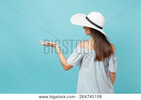 Back View Portrait Of Elegant Fashion Young Woman In White Summer Large Wide Brim Sun Hat, Dress Put