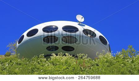 Landing Ufo And Caucasus Mountains Landscape Summertime. Dombai Nature, Russian Federation 10 June 2