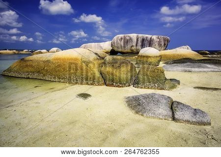 View Of A Group Of Big Stones On The Tanjung Tinggi Beach From Island Belitung/indonesia/