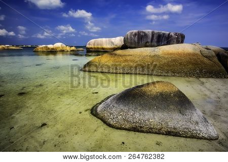 View Of A Group Of Big Stones On The Tanjung Tinggi Beach From Island Belitung/indonesia/