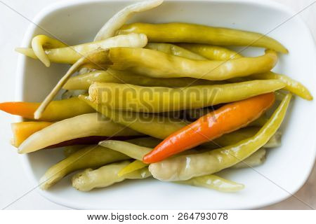Pickled Green Pepper Pickles In Bowls.