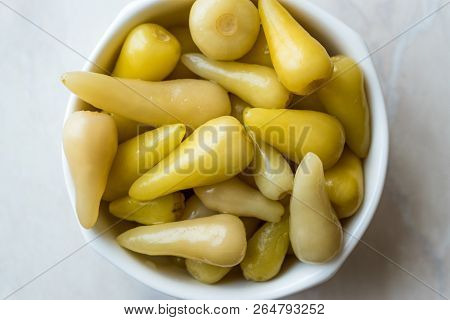 Pickled Green Pepper Pickles In Bowls. Traditional Organic Food.