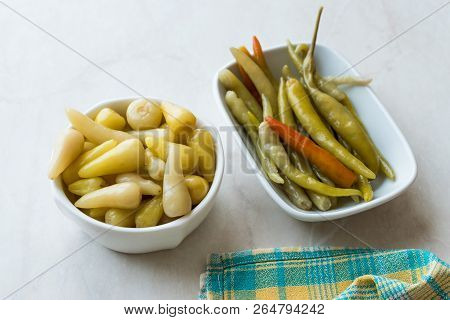 Pickled Green Pepper Pickles In Bowls.