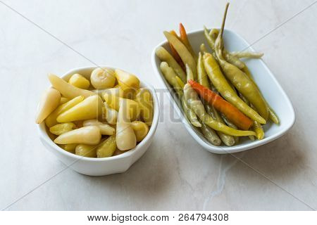 Pickled Green Pepper Pickles In Bowls.