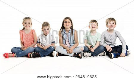 Group Of Five Young Children In Studio