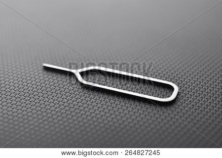 Sim Ejector Tool On Black Textured Background