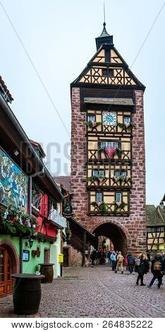 Riquewihr / France - December 25 2017: Tourists Visit Dodler Tower, In Rue Du General De Gaulle. The