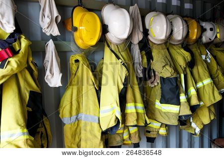 Firefighter Jackets And Helmets In Locker Room