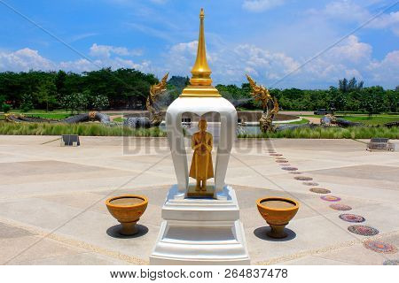 Small Buddha Stupa And Circular Cloth Mats On The Floor At The Entrance Of Buddhist Temple At Ban No