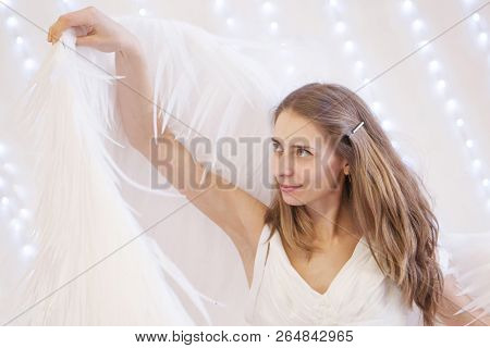 Girl In White Dress With Angel Wings On White Background. Angel-woman