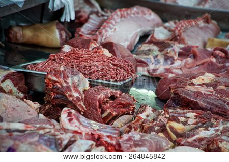Pieces Of Meat, Ribs, Bones And Minced Meat Lie On The Counter Of The Store. Raw Food.