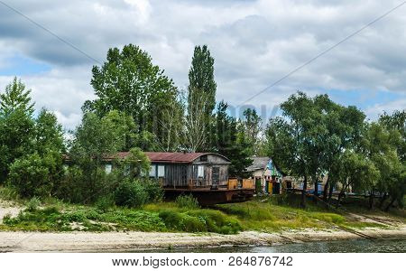 Old Rusty Fishing Boat Ship On The Bank Of The Pripyat River In The City Of Petrikov. Belarus