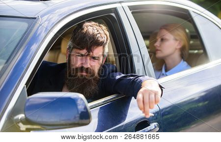 Business Woman Sit On Backseat While Bearded Driver Sit In Front. Car With Open Windows And Passenge