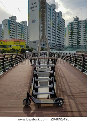 Geoje, South Korea - October 14, 2018 : Ninebot By Segway Es2 Kickscooter Park Near The Suspension B