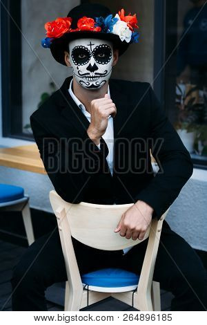 A Man With A Painted Face Of A Skeleton, A Dead Zombie, In The City During The Day. Day Of All Souls