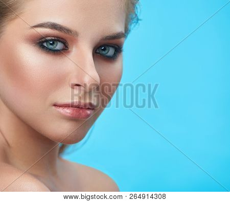 Portrait Of  Blond Blue Eyed Girl Looking Seriosly At Camera. Close Up Of Face Of Pretty Beautiful Y