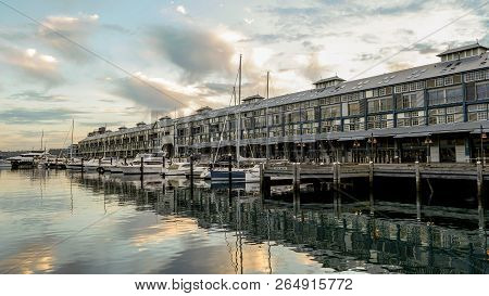 Yachts And Small Motor Boats Moor Along The Woolloomooloo Wharf In Sydney Harbour, Sydney Australia