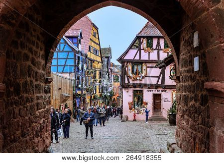 Riquewihr / France - December 25 2017: Christmas Decoration In Rue Du General De Gaulle. View Throug