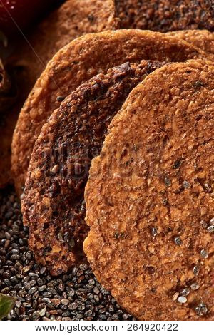 Close-up of oat homemade natural cookies from organic ingredients with chia seeds. Concept of healthy dieting food.