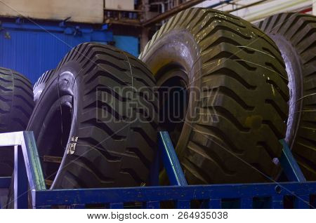 The Protector Of A Large Rubber Wheel. Huge Rubber Tire Career Dump Trucks, Mining Trucks From The T