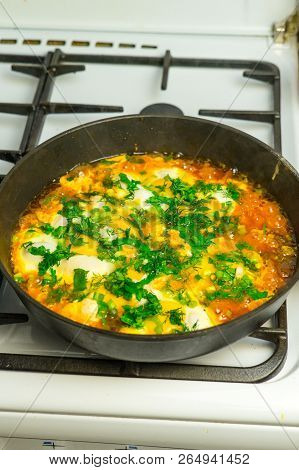 Cook Shakshuka On A Gas Stove In A Frying Pan.