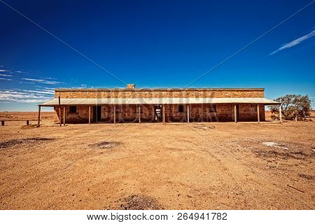 Australia â Outback desert with an old abandoned vintage railway station near the old Ghan under blue sky 