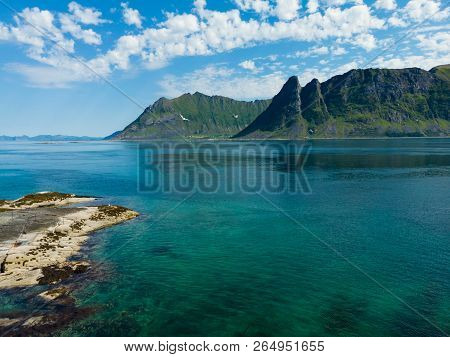 Coast Of Gimsoya Island In Summertime. Sea With Mountains. Nordland County, Lofoten Archipelago Norw