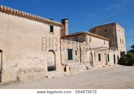 MAJORCA, SPAIN - SEPTEMBER 30, 2018: The old farm buildings at the entrance to the Boquer valley walk in Puerto Pollensa. The 3km trail leads though the Tramuntana mountains to Cala de Boquer.