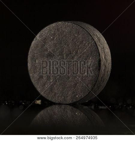 Medical Drug, Black Tablet Activated Carbon On A Black Background In Backlight