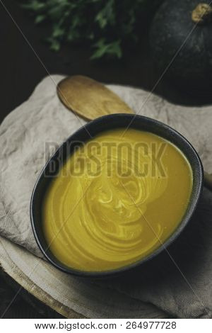 Vegeratian Creamy Soup In Bowl Over Rustic Background, Top View, Healthy Eating Seasonal Food