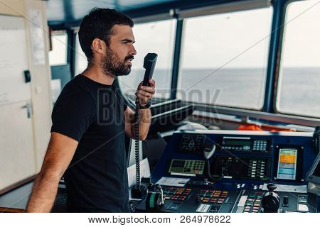Marine Navigational Officer Is Reporting By Vhf Radio