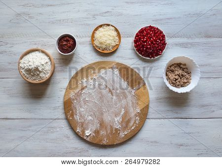 Preparation Of Traditional Arabic Pizza Manaqish With Meat And Pomegranate
