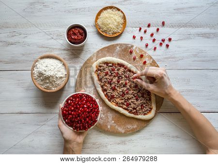 Preparation Of Traditional Arabic Pizza Manaqish With Meat And Pomegranate
