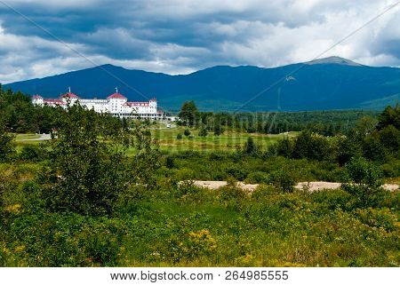 Sun Breaks Through Clouds Over Mount Washington And Hotel In New Hampshire White Mountains.