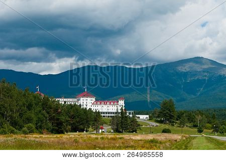 Sun Breaks Through Rain Clouds By Mount Washington Behind Famous Hotel In The White Mountains Of New