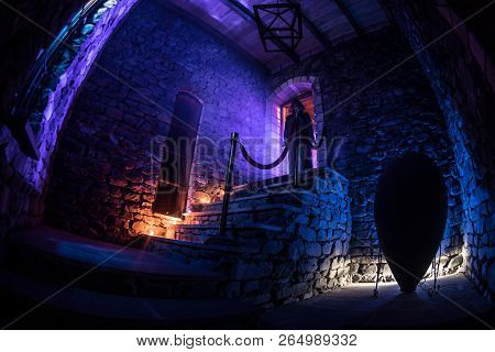 Inside Of Old Creepy Abandoned Mansion. Staircase And Colonnade. Silhouette Of Horror Ghost Standing