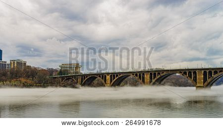 Francis Scott Key Bridge Across Potomac River, Winter Fog On The Water.
