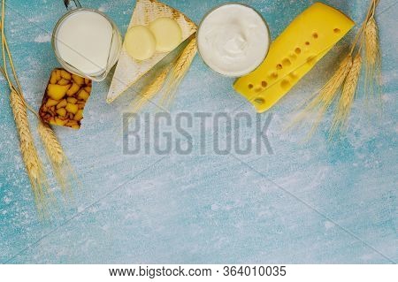 Dairy Products On Blue Background. Jewish Holiday Shavuot Concept.