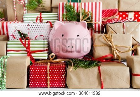 Piggy Bank And A Lot Of Gift Boxes. Christmas Decor. White Background. Fir Branches.