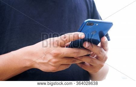 Young asian or  Indian man using smartphone