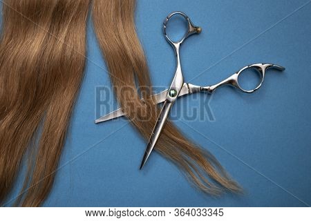 Flat Lay Composition With Light Brown Hair, Comb, Scissors And Space For Text On Color Background. H