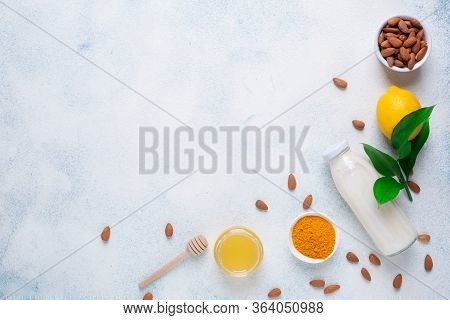 Lemon, Yogurt, Almond Nut, Turmeric And Honey On A White Background. Five Products For Immunity. Bac